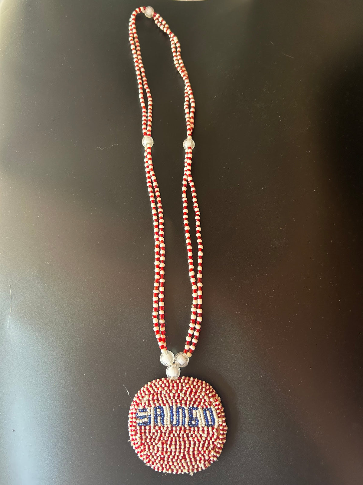 Șango Ileke with name pendant